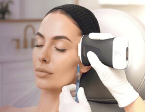 Provider using ultrasound imaging to safely guide aesthetic facial injections, visualizing facial anatomy in real time.